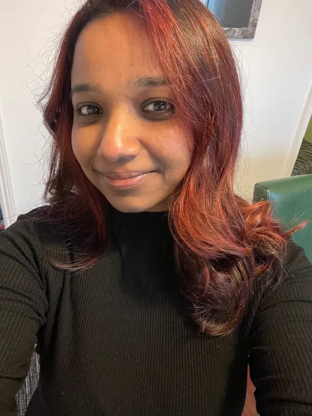 A happy client after her colour at The Hair Room