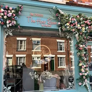 The flower-framed shopfront of The Hair Room